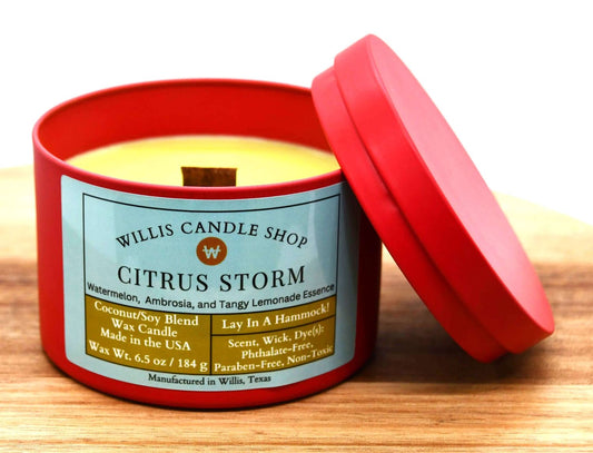 Citrus Storm fragrant candle option as a red tin candle and wood wick candle.