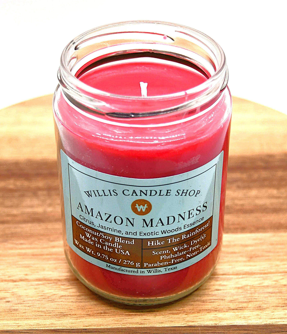Single wick candle with Amazon Madness fragrant candle option and red wax color.