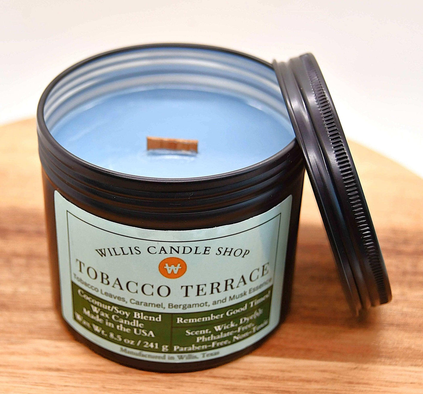 Tobacco candle on wood tray at Willis Candle Shop.