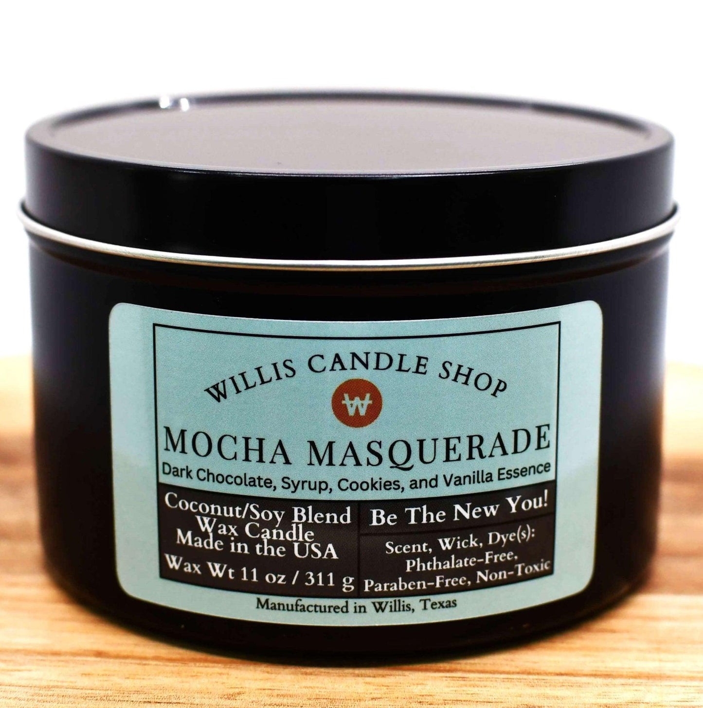 Scented Candle in black tin with lid.