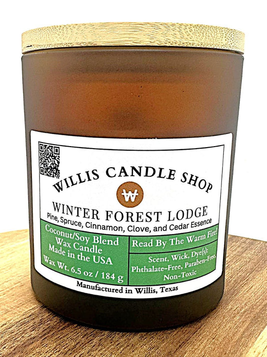 Amber frosted glass candle vessel with bamboo lid and green and white label.