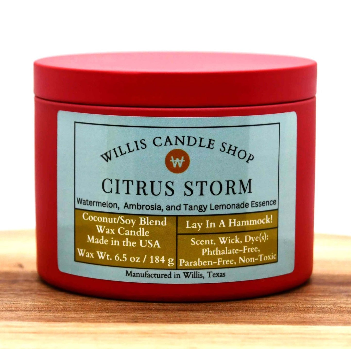 Red tin scented candle option with Citrus Storm fragrant candle shop selection.