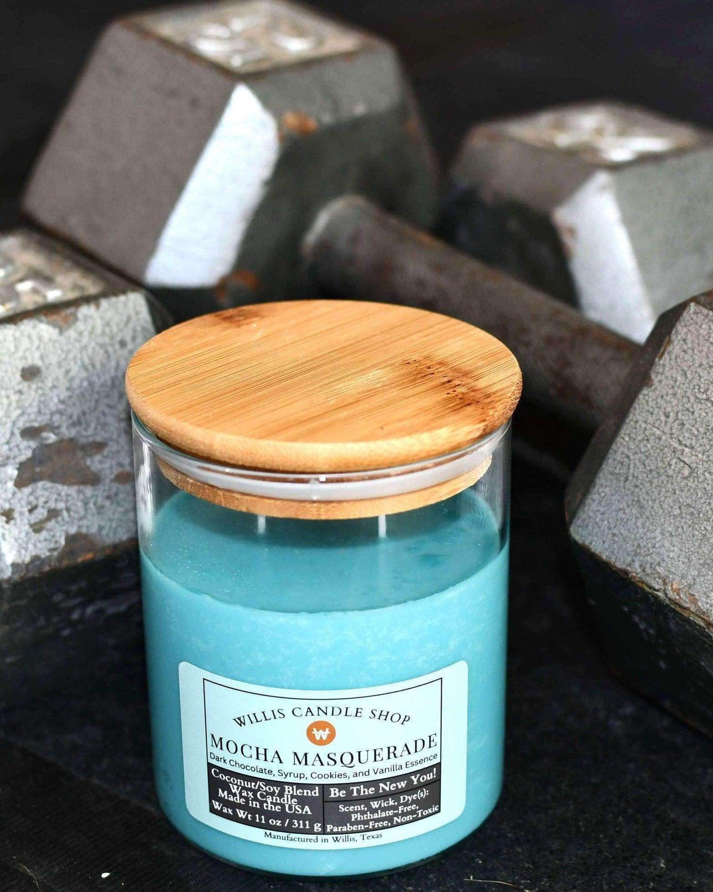 Luxury candle wth barbells as lifestyle photo and scented candle at Willis Candle Shop.