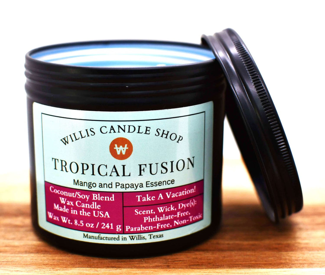 Black tin candle with Tropical Fusion scent.