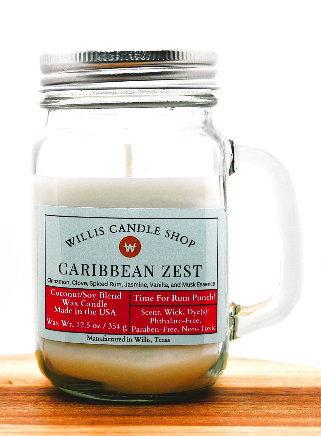 Caribbean Zest scented candle with mug jar design and meta screw-on lid.