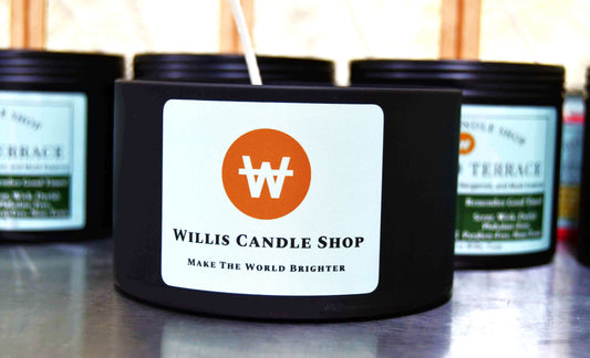 Test candle production at the Willis Candle Shop with large black tins.