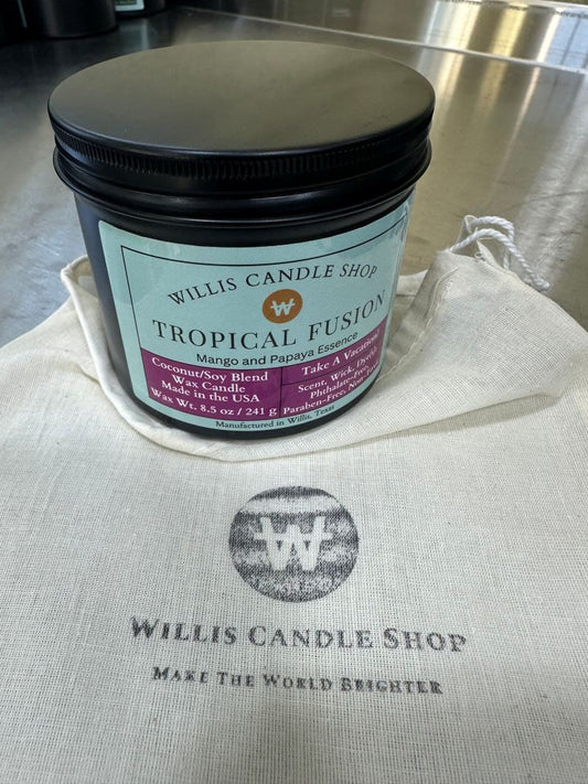 Black tin candle with Tropical Fusion scent and burlap logo bag.