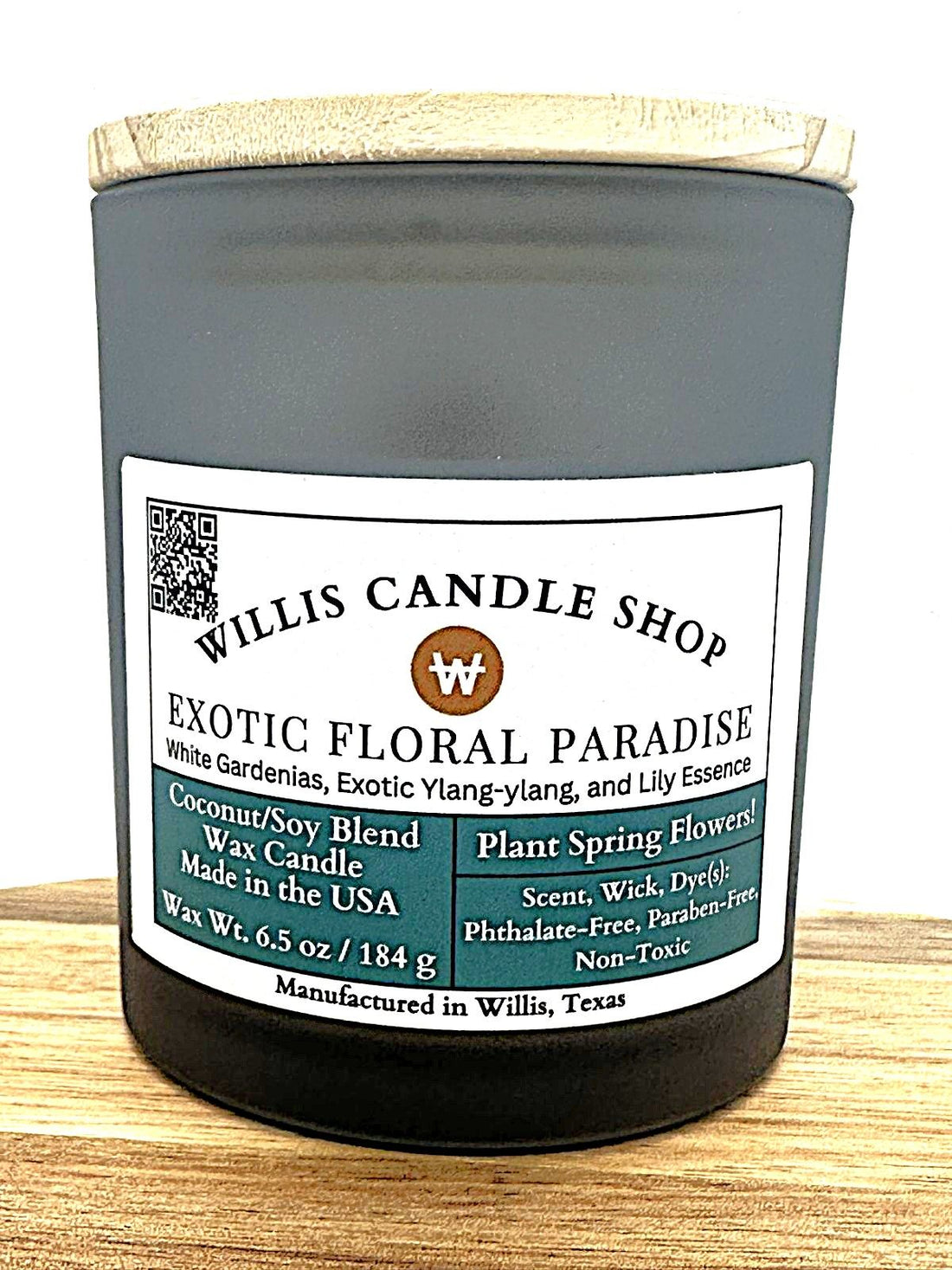 Frosted glass candle with bamboo lid and floral scent.