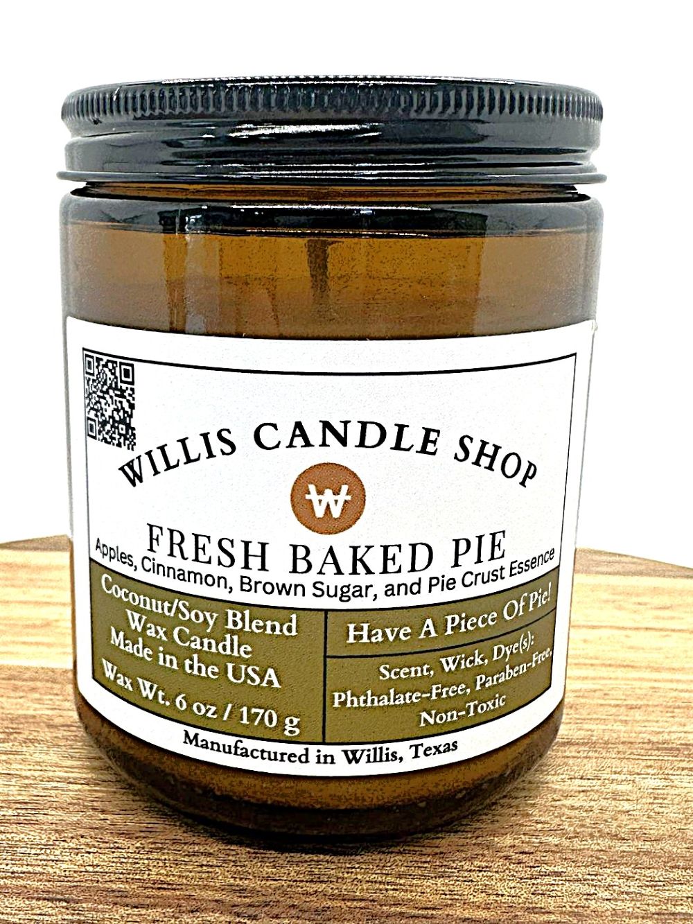 Amber glass candle with Fresh Baked Pie scent at the Willis Candle Shop.
