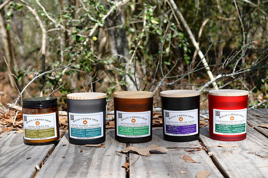 Scented candle collection staged on a bridge at the Willis Candle Shop.