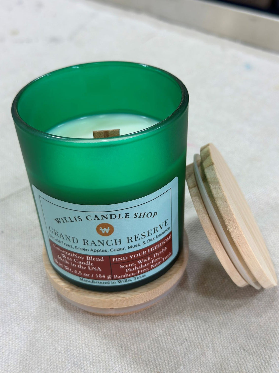 Grand Ranch Reserve candle with bamboo lid and wood wick candle option.