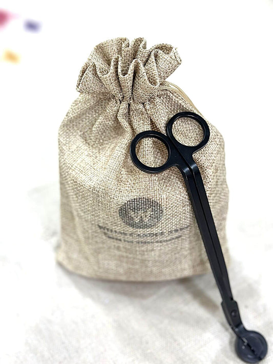 Scented candle in a bag with wick trimmers in Willis, Texas.