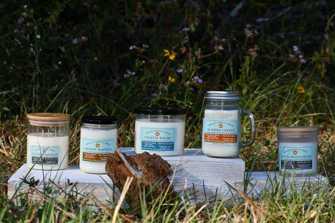 White wax scented candle in a field staged on boxes in Willis, Texas.