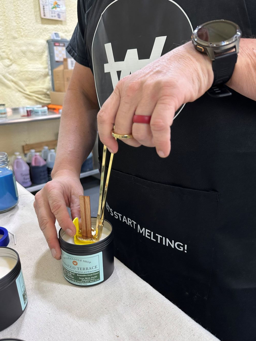Wick trimming at the Willis Candle Shop with the Tobacco Candle.
