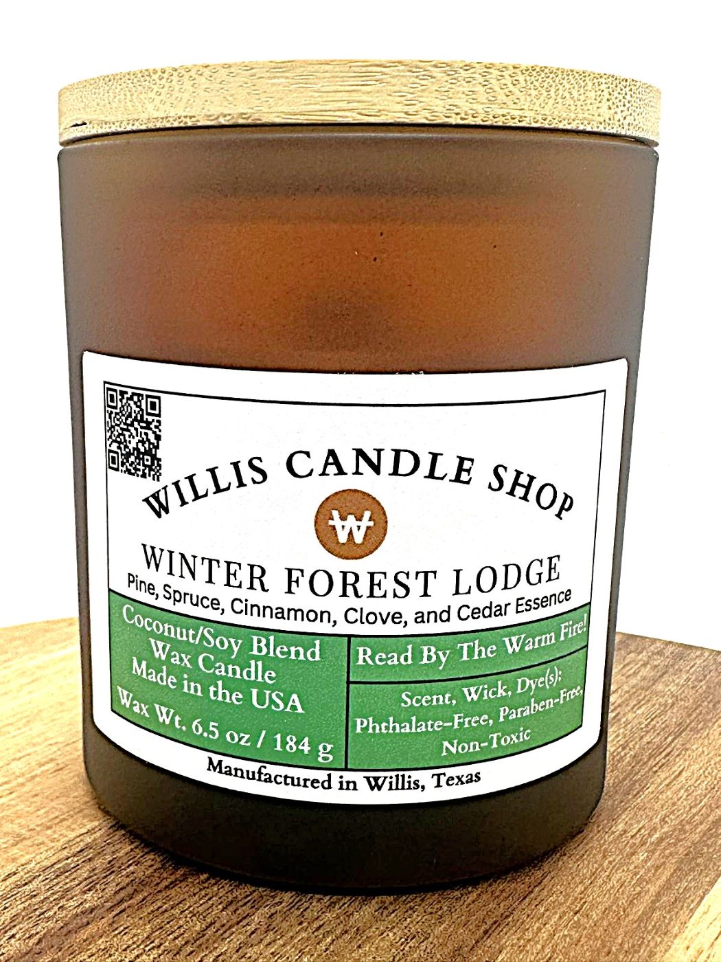 Amber frosted glass candle with bamboo lid and winter fragrance.