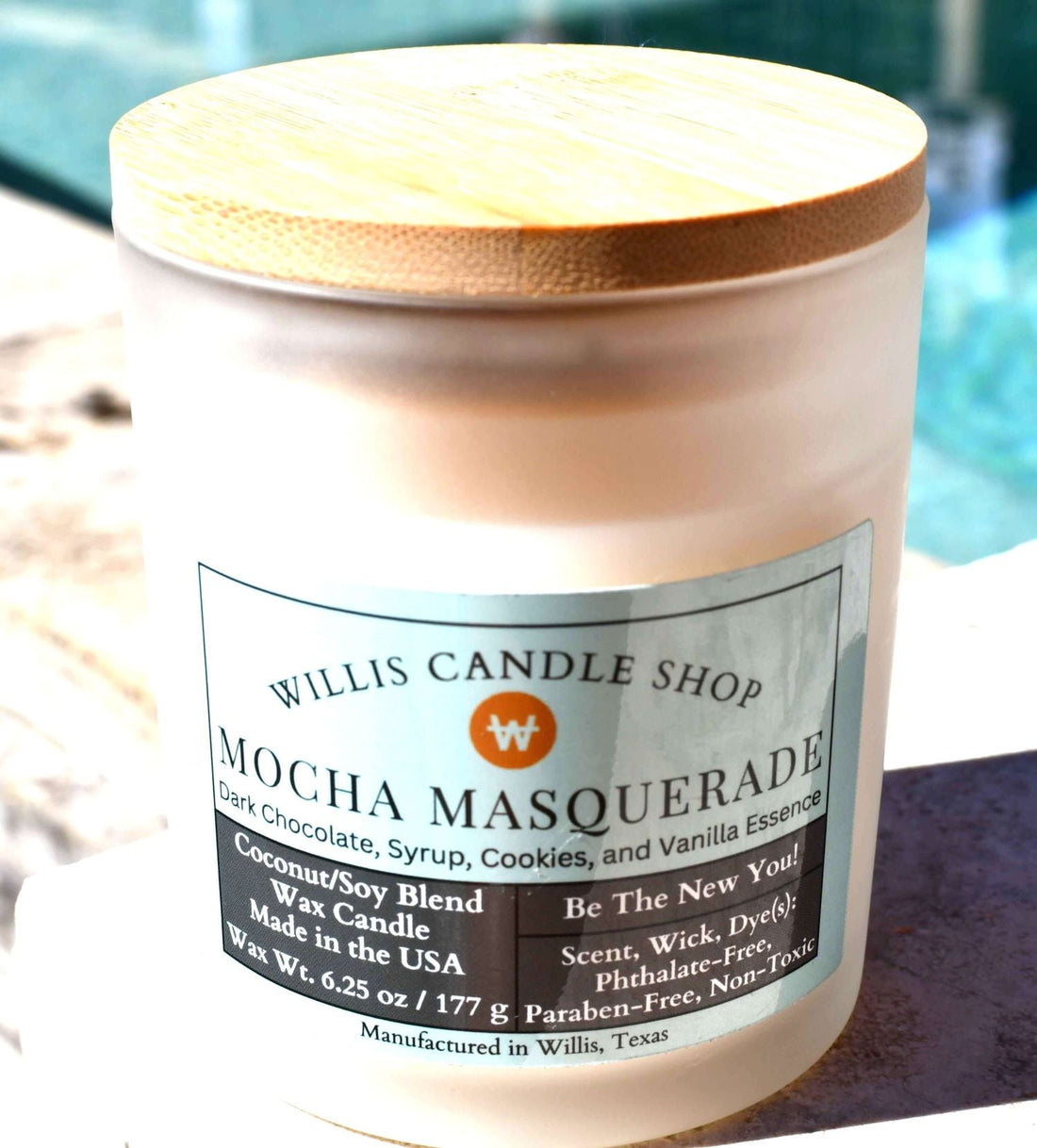 White frosted glass candle with bamboo lid and Mocha Masquerade scent.
