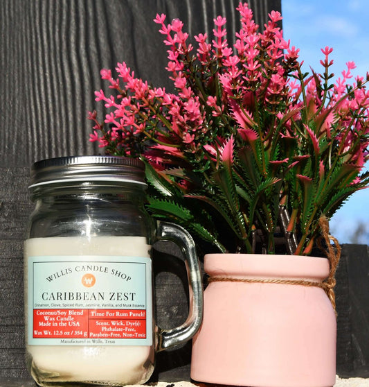 Vanilla candle on front porch with flowers at Willis Candle Shop.
