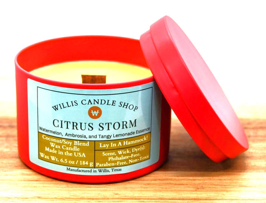 Red tin candle with wooden wick candle option and Citrus Storm fragrance.