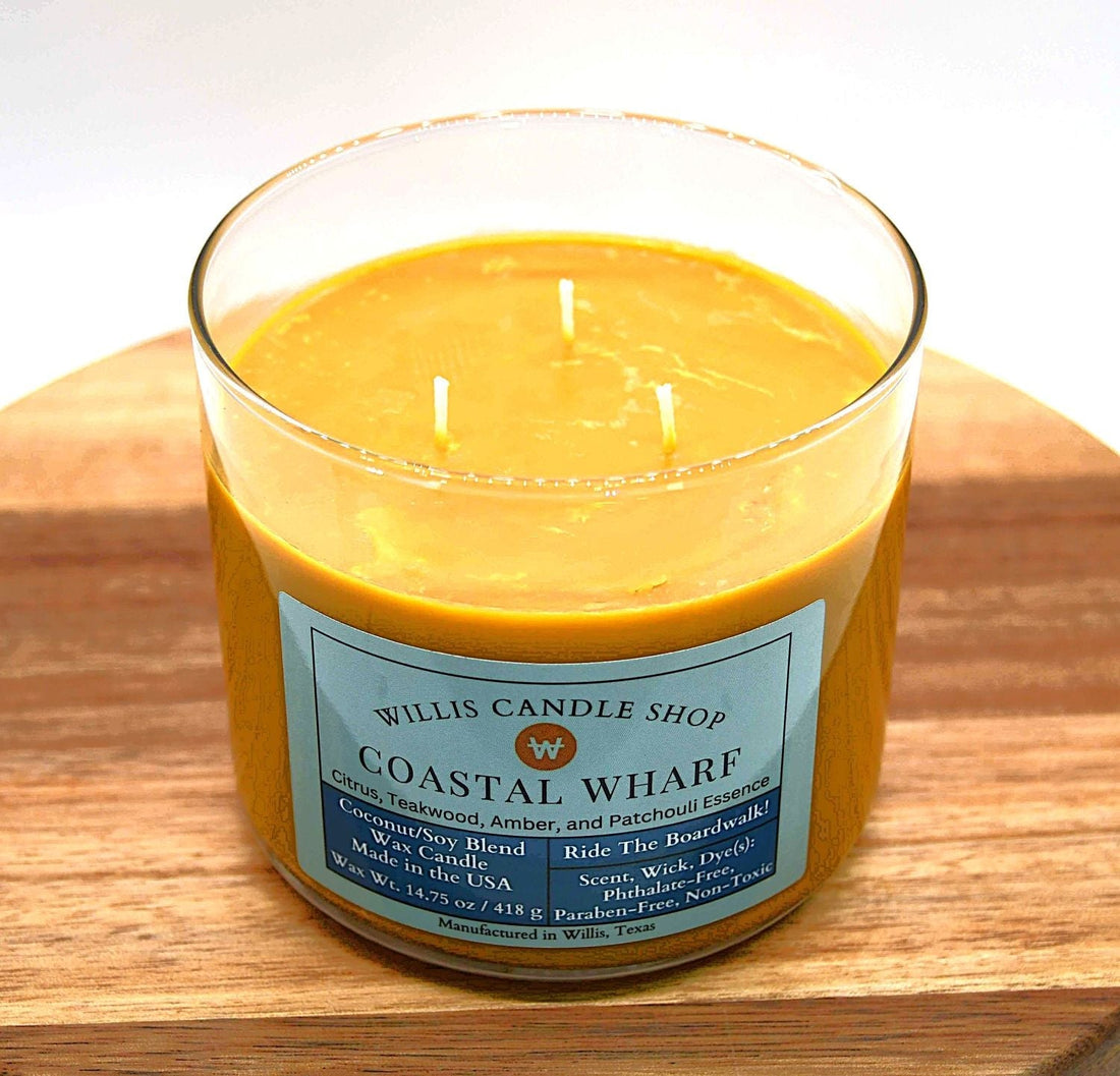 Coastal Wharf scented candle with 3 wick candle option and orange wax.