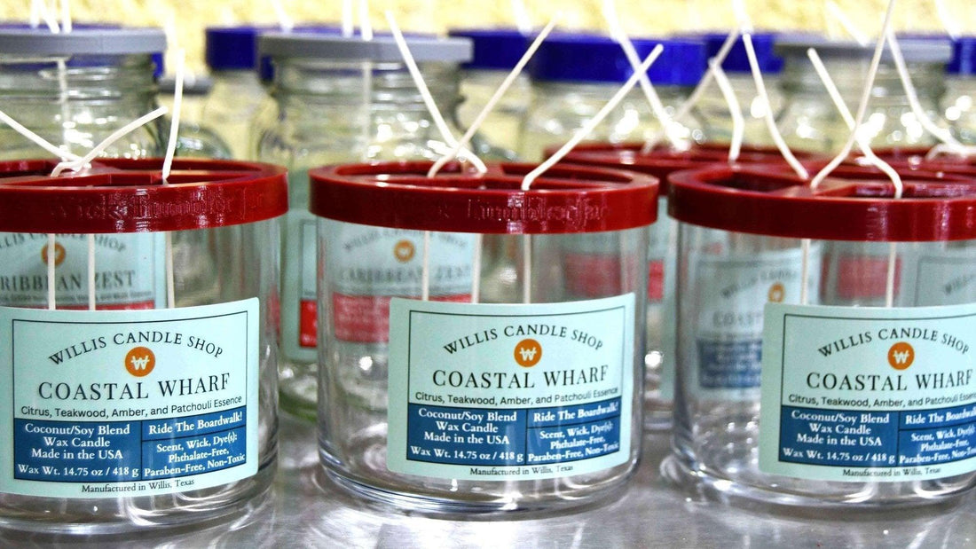 Wicking and labeling scented candles for production at the Willis Candle Shop.