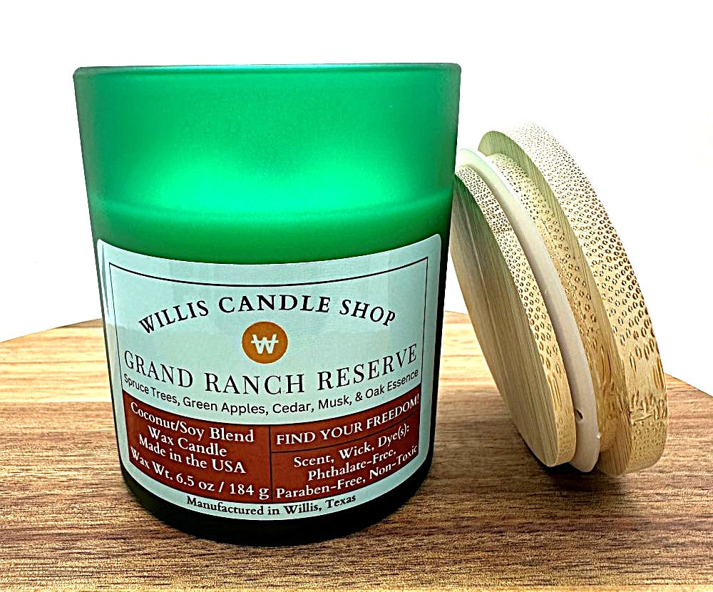 Green frosted glass candle with bamboo lid and Grand Ranch Reserve scent.