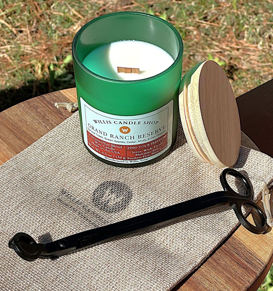 Green frosted glass candle with bamboo lid and wick trimmer.