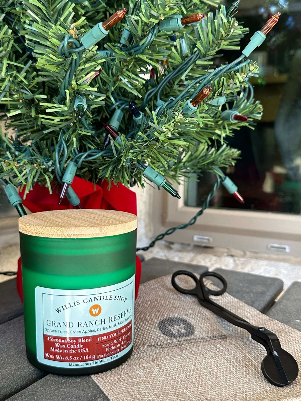 A handcrafted Grand Ranch Candle Wick Trimmer Christmas candle vessel from The Willis Candle Shop.