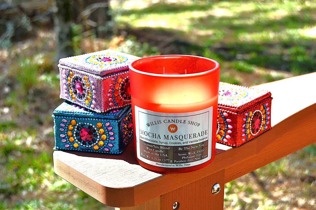 Red frosted glass candle with knick-knacks on the arm of a chair.