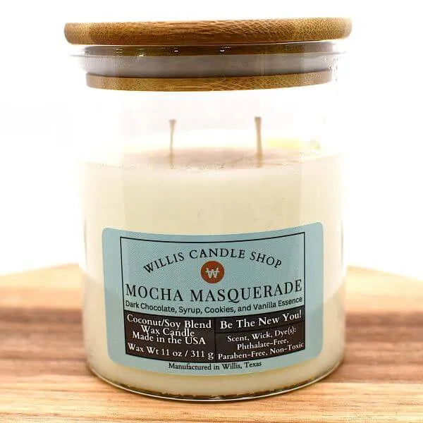 Clear glass candle with bamboo lid and Mocha Masquerade scent.