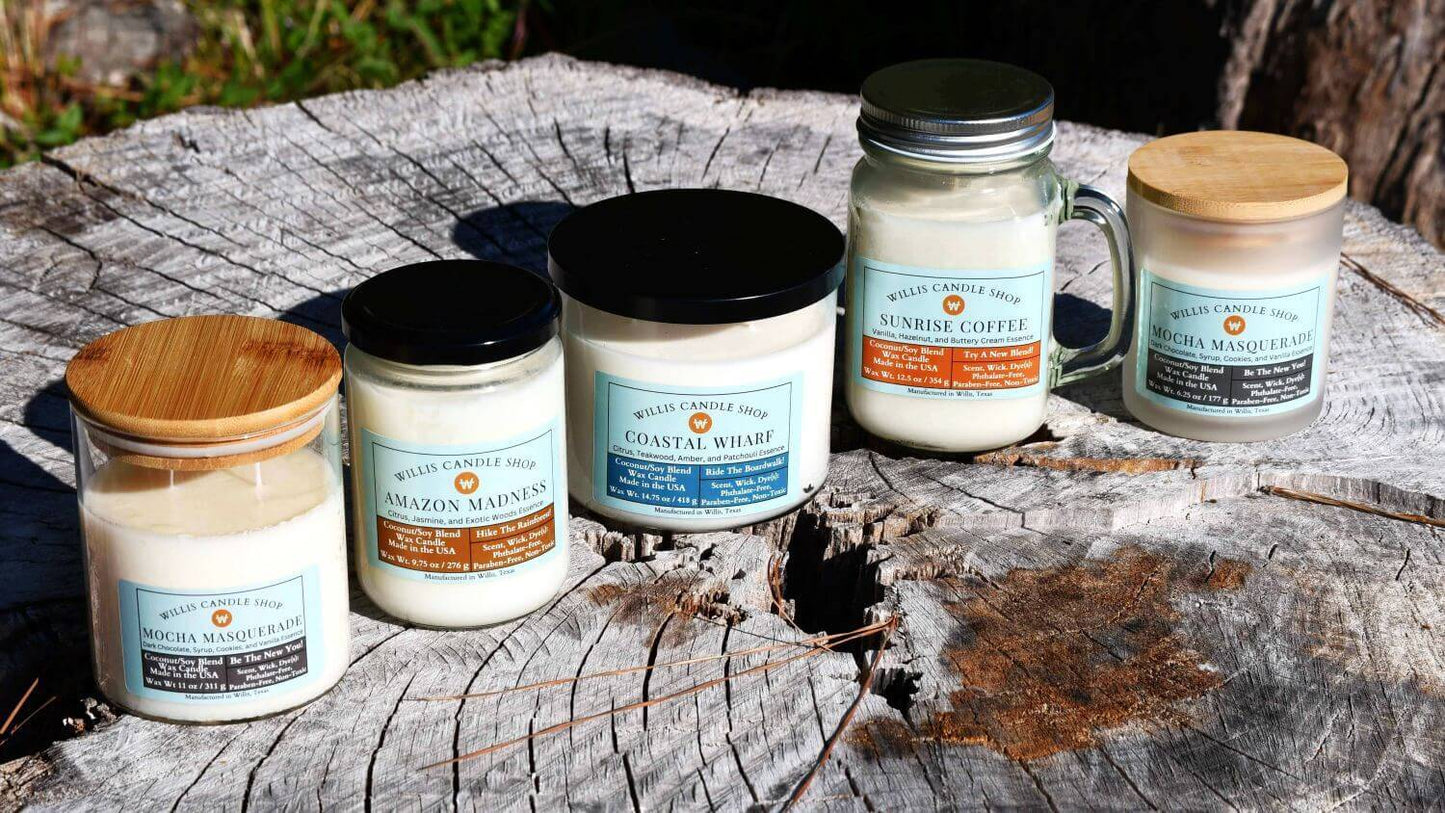 aroma candle collection at the on a tree stump at the Willis Candle Shop.