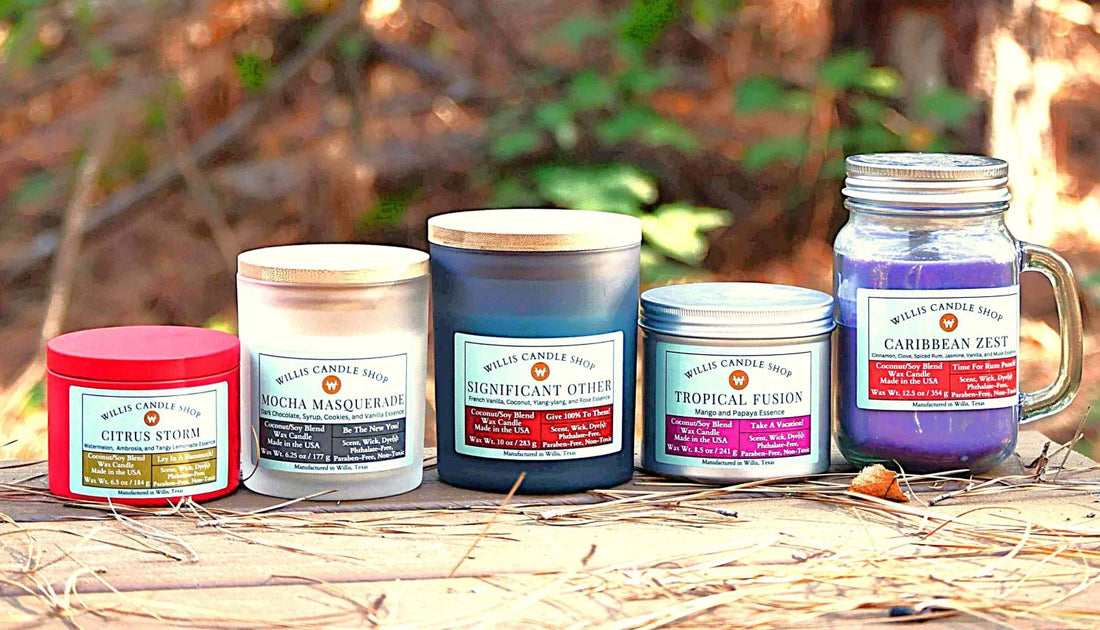 Scented candle collection in forest at Willis Candle Shop.