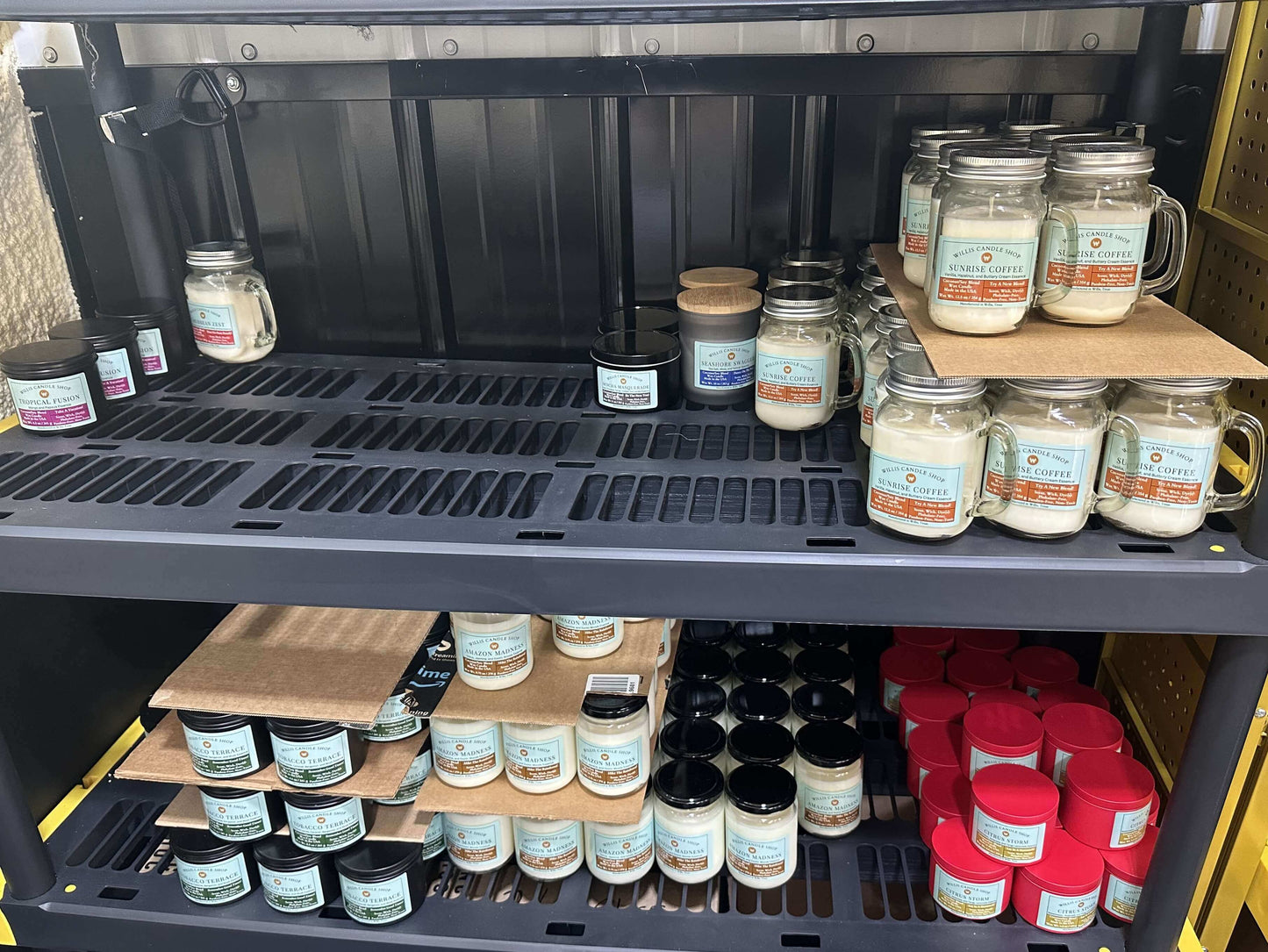 scented candles stored on shelf at Willis Candle Shop.