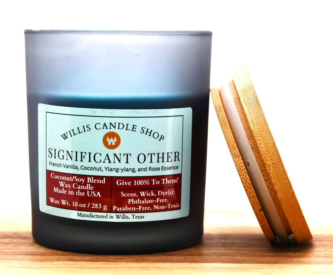 Black frosted glass candle with bamboo lid in Willis, Texas.