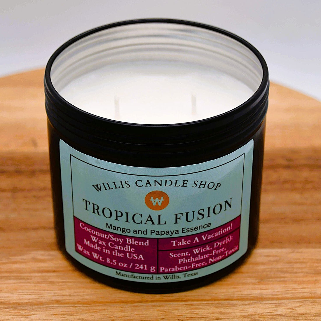 black tin candle with Tropical Fusion fragrance and double wick candle option.