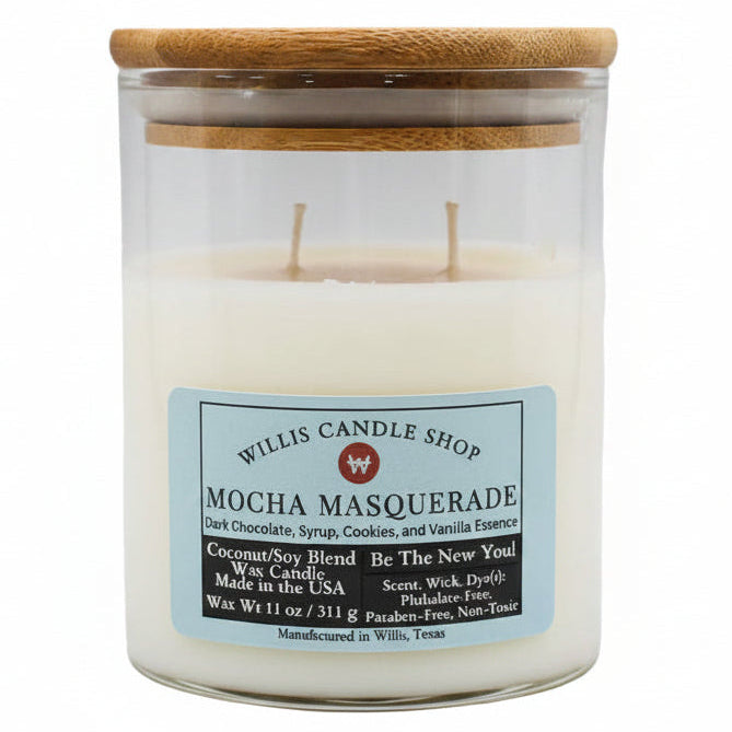 Candle with a wooden lid labeled 'Willis Candle Shop Mocha Masquerade' on a wooden surface.