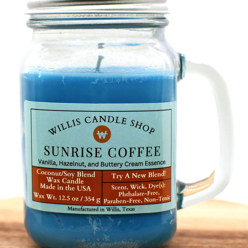 
                  
                    Blue coconut and soy 25/75 blended candle with a vanilla, hazelnut Sunrise Coffee fragrance in a glass mug jar.
                  
                