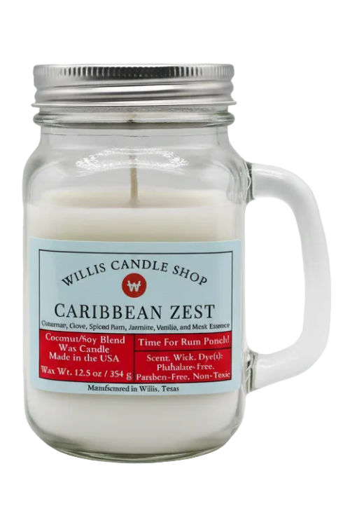 A glass jar candle with a metal lid and handle, filled with white wax, featuring a light blue and red label from Willis Candle Shop for the Caribbean Zest scent.