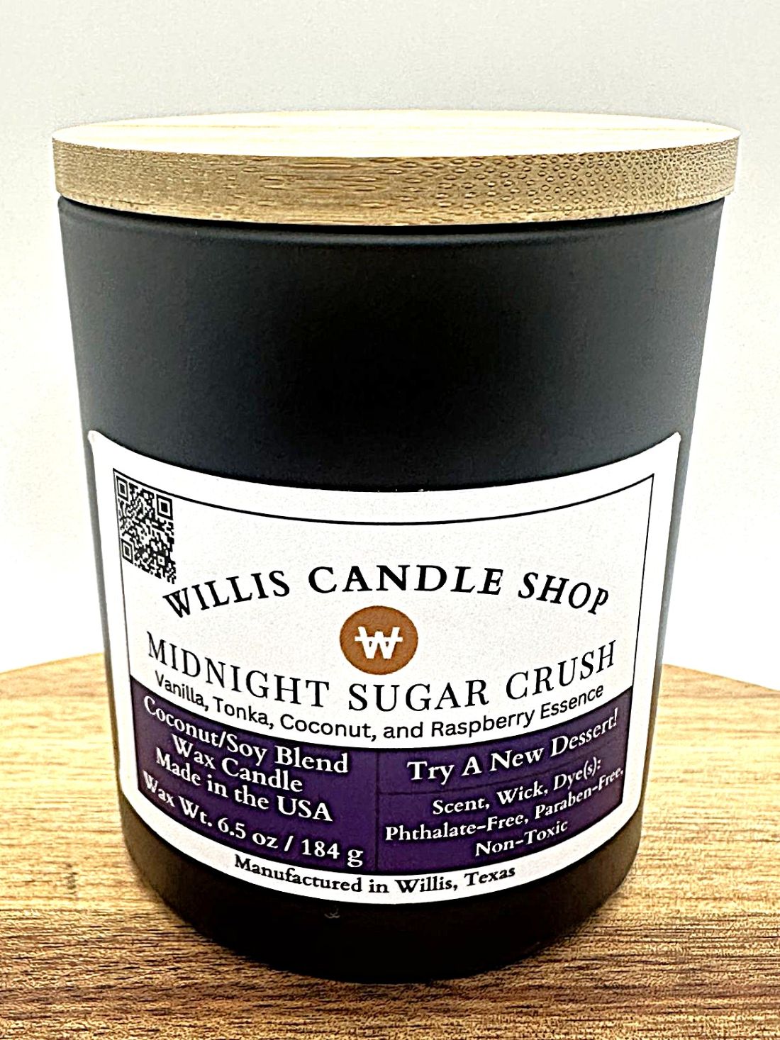 Midnight Sugar Crush scent in a black candle vessel with bamboo lid.