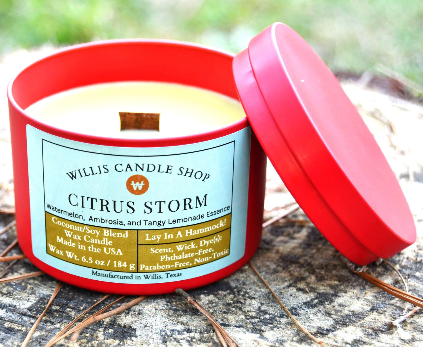 Yellow wooden wick coconut and soy 25/75 blended red tin candle with 6.5 ounces of wax and Citrus Storm Fragrance.