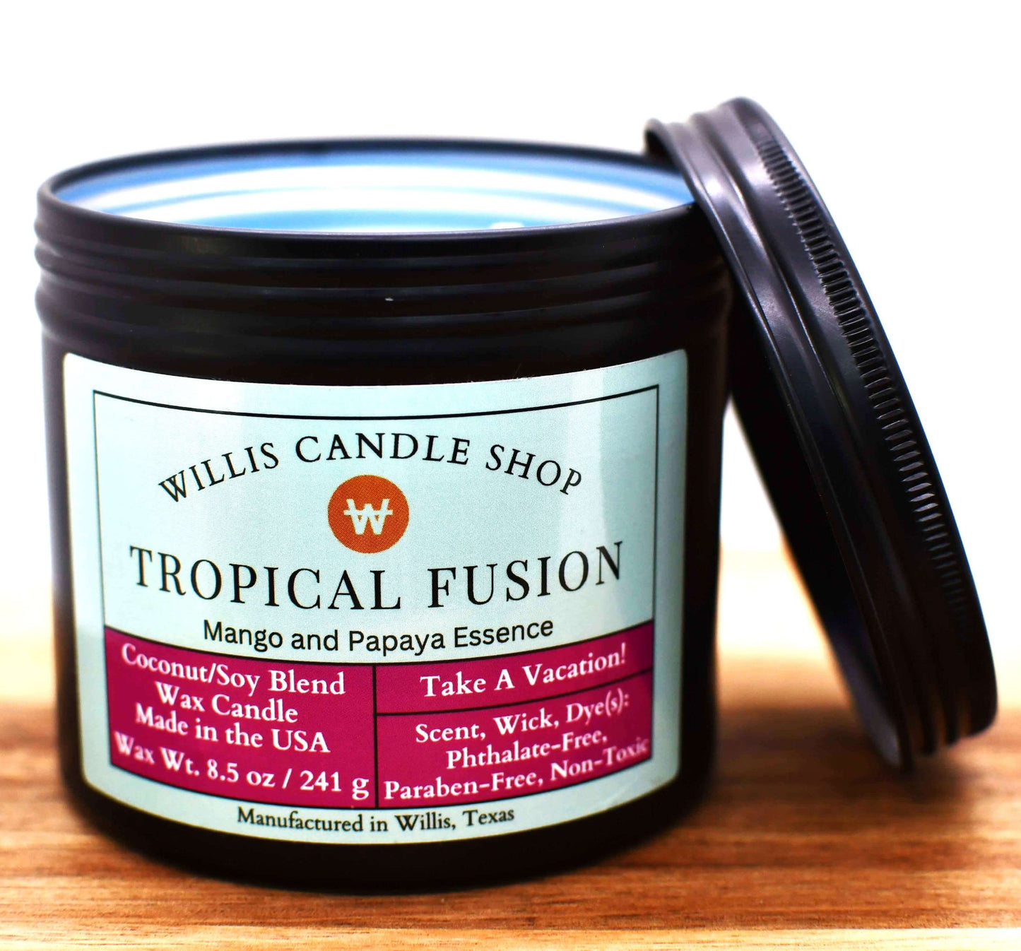 Blue coconut and soy 25/75 blended candle in a 10 ounce black tin with mango and papaya essence.