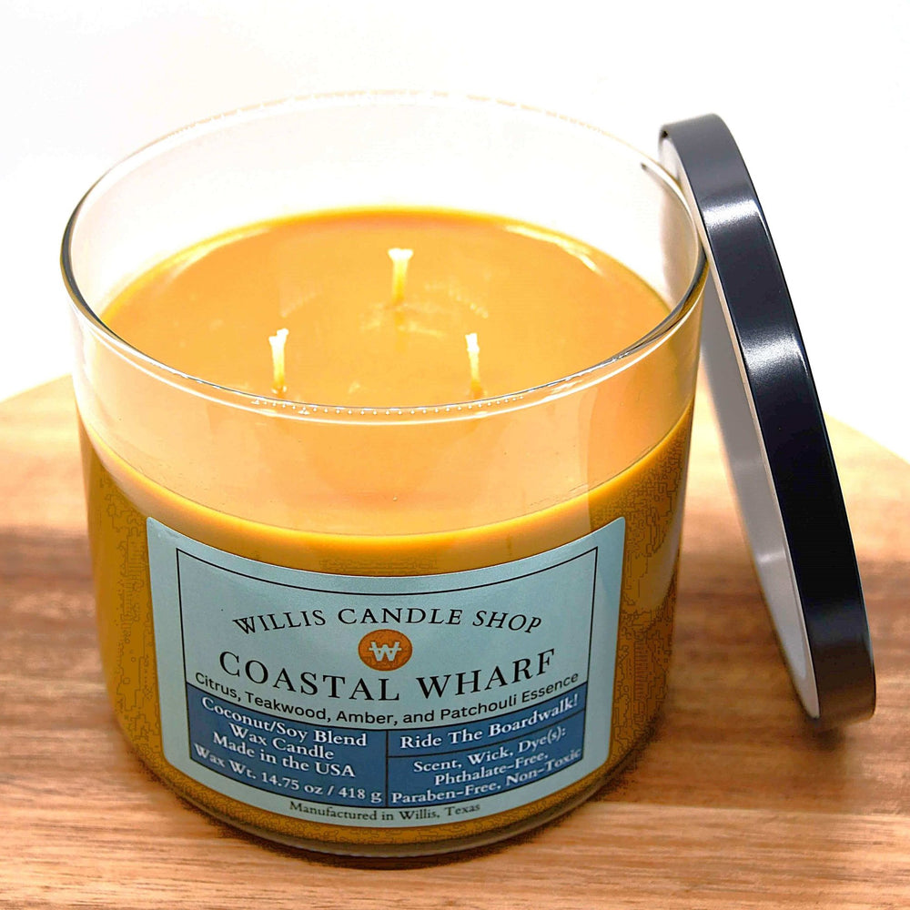 
                  
                    14.75 oz Coastal Wharf scented coconut-soy wax candle with burnt orange wax in a Contempo glass vessel.
                  
                