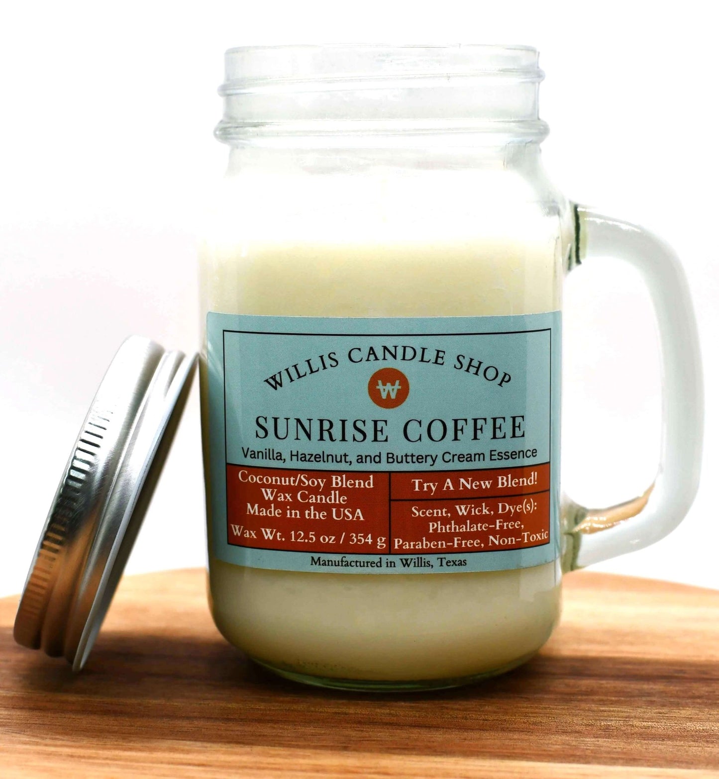 White coconut and soy 25/75 blended candle in a glass mug with vanilla and hazelnut Sunrise Coffee fragrance.