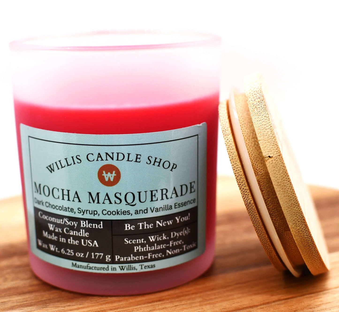 Red coconut and soy 25/75 blended candle Mocha Masquerade scent in a 10 ounce white-frosted container with bamboo lid.