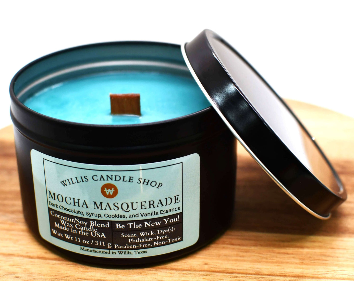 Sea-green coconut and soy 25/75 blended candle with wooden wick in a 14 ounce black tin container.