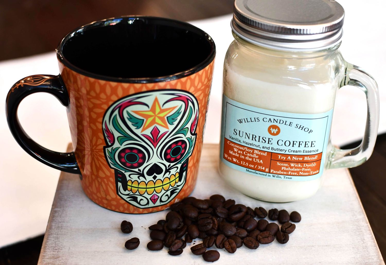 Scented candle as non-toxic candle option with cool mug, coffee beans at Willis Candle Shop.