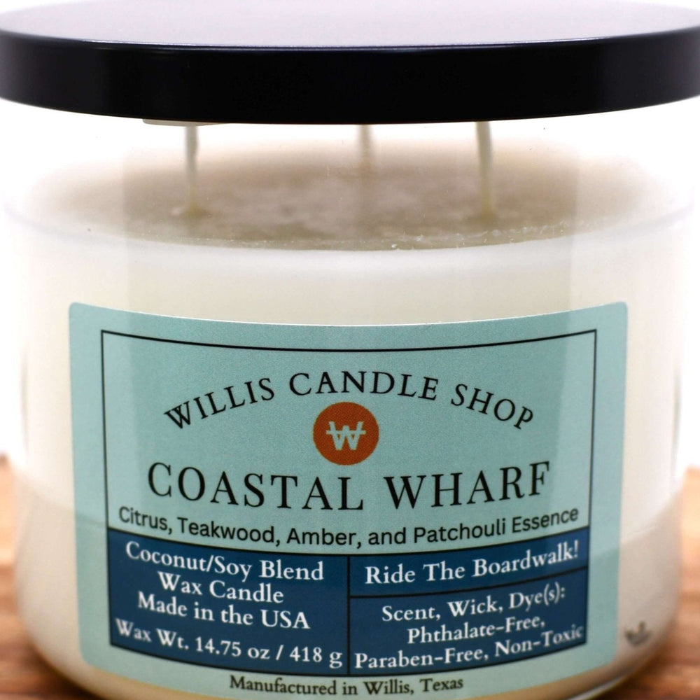 White coconut and soy 25/75 blended candle in a 21 ounce glass container with citrus, teakwood, amber, and patchouli scent.