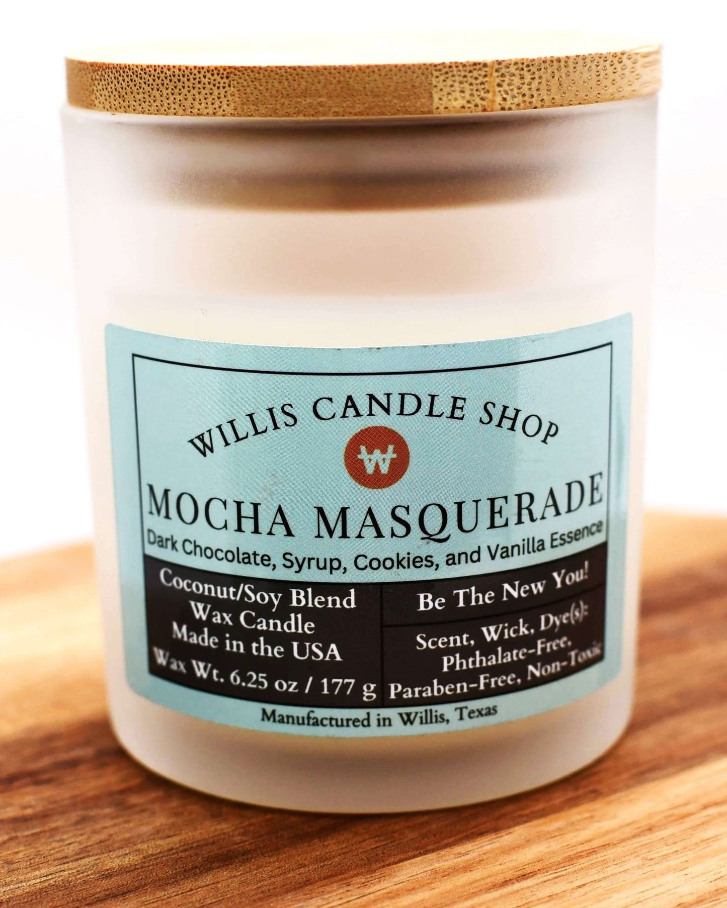 White coconut and soy 25/75 blended candle in a 10 ounce white-frosted glass container with Mocha Masquerade.