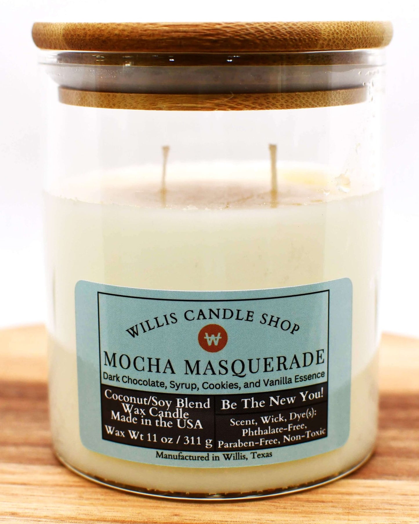 White coconut and soy 25/75 blended candle in an elegant glass container with bamboo lid and Mocha Masquerade.