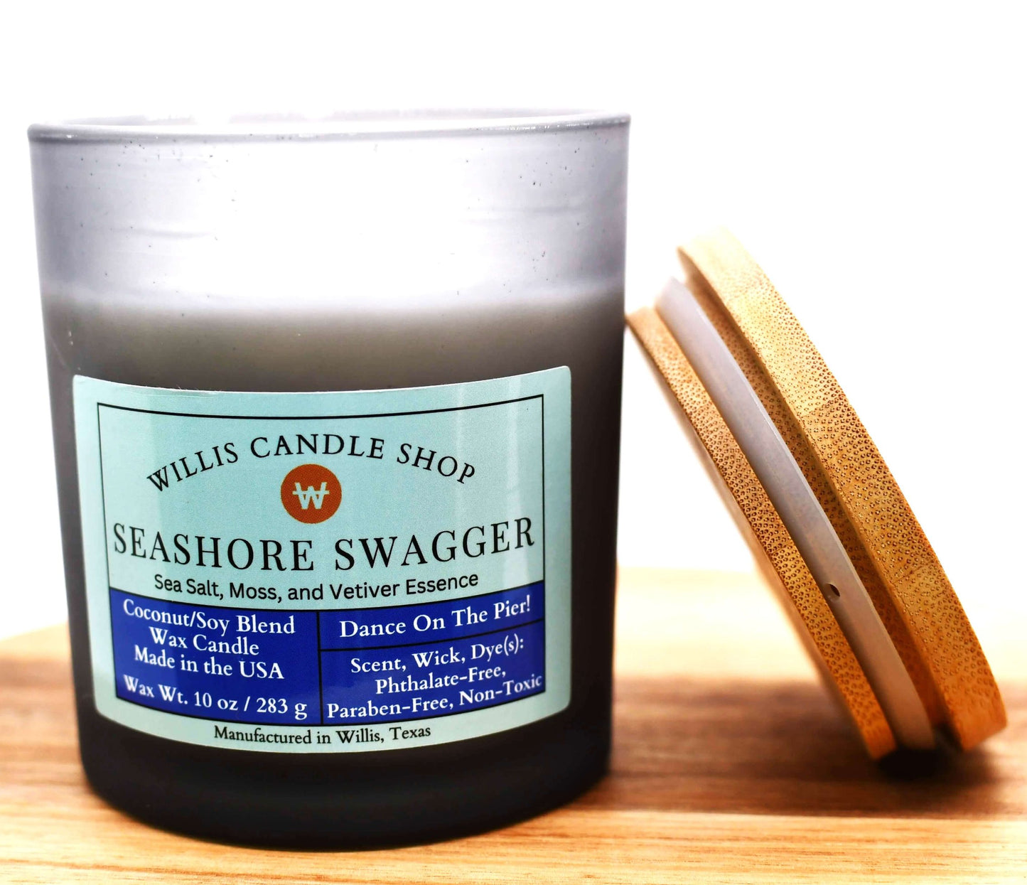 White coconut and soy 25/75 blended candle with Seashore Swagger in a 14.5 ounce black-frosted container.